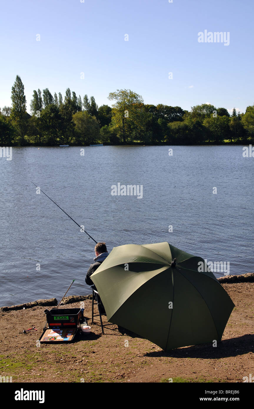 Angler at Powell`s Pool, Sutton Park, West Midlands, England, UK Stock Photo